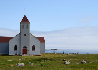 white church with red roof on Ile aux Marin, Saint Pierre and Miquelon