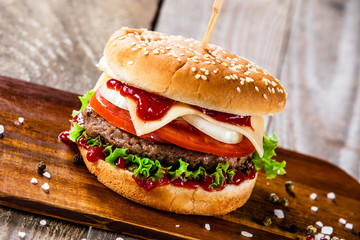 Tasty burger on cutting boarrd