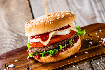 Tasty burger on cutting boarrd