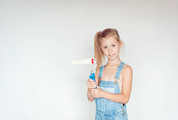 little girl with paint brush