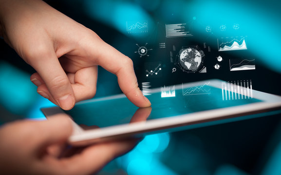 Hand holding tablet with global business concept