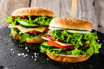 Tasty burgers served black stone plate