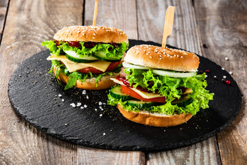 Tasty burgers served black stone plate