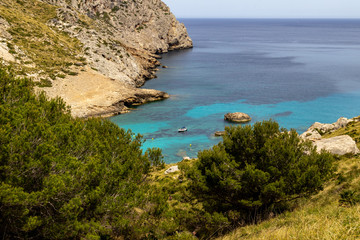 Fototapeta na wymiar Scenic view on wonderful rocky bay Cala Figuera on balearic island Mallorca, Spain on a sunny day with clear turquoise water in different colors