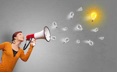 Person talking in megaphone with bulb, new idea concept