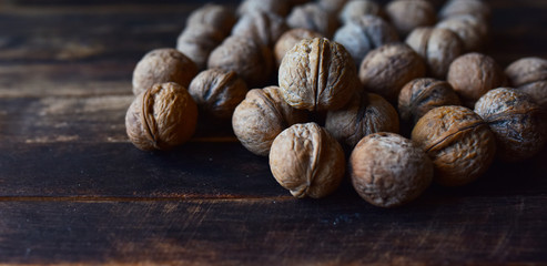 walnuts in a shell on a wooden table