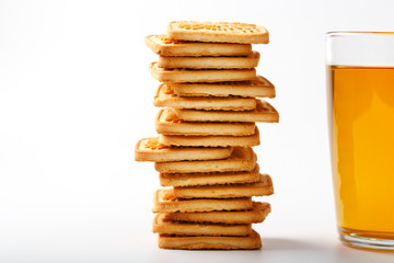 Fototapeta na wymiar Mug of green tea and wheat cookies on a light background. Breakfast Cookies. Close up
