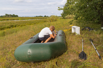 A child is preparing an inflatable boat