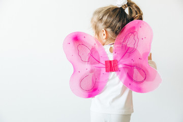 girl with pink butterfly wings