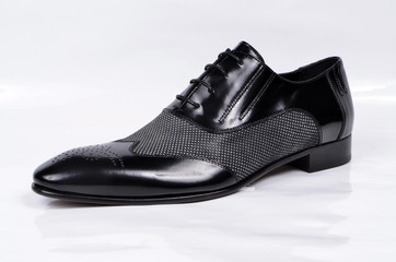 A formal dot pattern black executive shoe