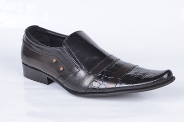 An isolated Black texture executive shoe with brown strips