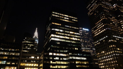 Fototapeta na wymiar New York City Buildings At Night With Black Sky Background