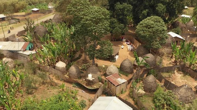 Rotating drone flight of small tribal village with classic huts made of straw and other natural material, tribal community in Dorze, Ethiopia