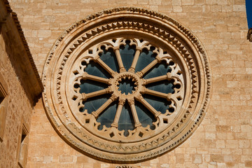 Fototapeta na wymiar Glass and stone rosette front view in a monsatery.