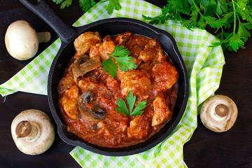 Beef stew with mushrooms in tomato sauce
