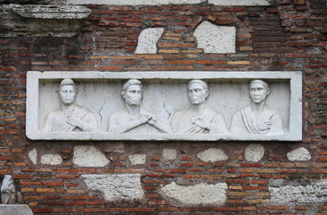 Basrelief in Appian way. Rome, Italy