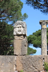 Satiric mask in Ostia Antica. Rome, Italy