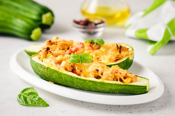 Stuffed zucchini boats. Selective focus, space for text.
