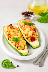 Stuffed zucchini boats. Selective focus, space for text.