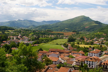 Naklejka na ściany i meble European mountainside town during the summer.