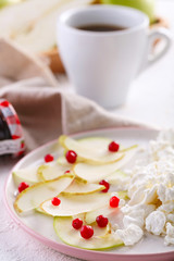 cottage cheese with slices of pear, Apple and cranberries