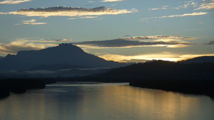 Fototapeta na wymiar Mount Kinabalu during sunrise over Sulaman River Bridge