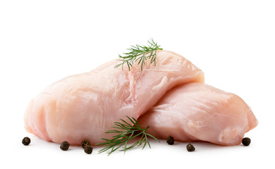 Two raw Turkey breast with leaves of dill and pepper on a white. Isolated.