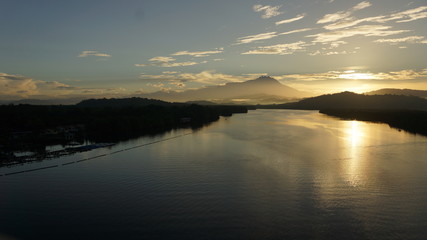 Fototapeta na wymiar Mount Kinabalu during sunrise over Sulaman River Bridge
