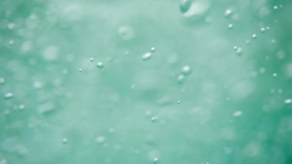 Bubbles rising to the surface. Air bubbles in water in sea (underwater shot), good for backgrounds. Slow motion.