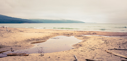 Beautiful misty coastal View from the beach of Lake Superior on a stormy summer day at Neys Provincial Park, Ontario, Canada