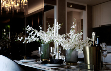 preparing dishware on romantic dinner table