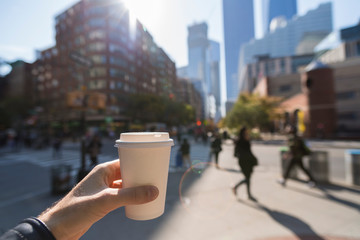 Man holding a coffee cup in New York City