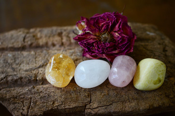 Positivity Crystals, Mindfulness. Tumbled Crystal Bundle: Rose Quartz, Citrine, Serpentine, and Milky Quartz. Energy Spring Cleaning. Variety of healing crystals, pastel colors in natural lighting