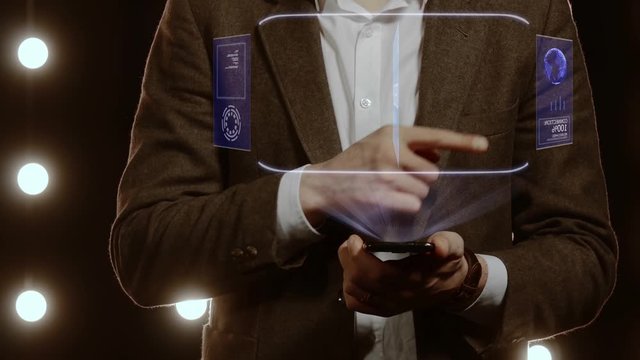 Businessman activates conceptual HUD hologram on smartphone with text Develop. Man in a white shirt and jacket with a holographic screen on the background of lights