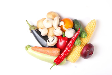 Set of different fresh vegetables on a white background top view.