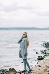 journey outdoors in the summer. smiling portrait of a girl on the lake.