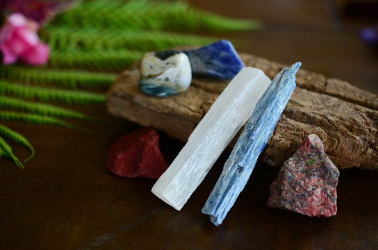 Assortment of healing crystals, like selenite, blue kyanite, red jasper, unakite, and sodalite! Macro photography of high energy, healing stones. Reiki energy healing talisman. 