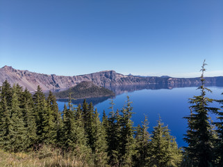 Wizard Island through the Evergreens