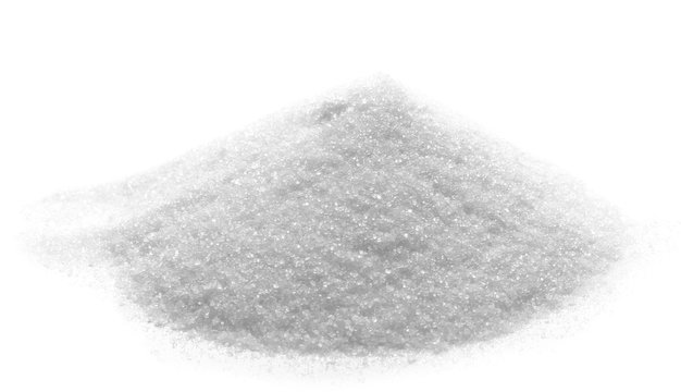 Sugar crystal pile isolated on white