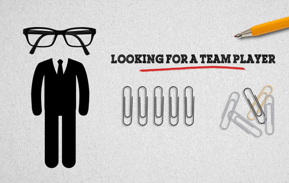 office utensils on paper with message "looking for a teamplayer"