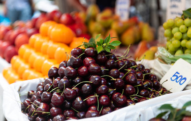 Fresh cherry fruits group in the market.