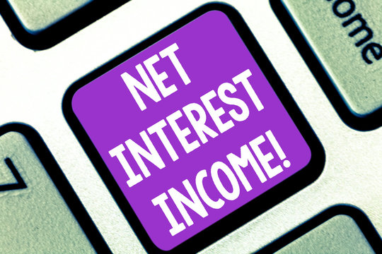 Writing note showing Net Interest Income. Business photo showcasing difference between revenue generated and expenses Keyboard key Intention to create computer message pressing keypad idea