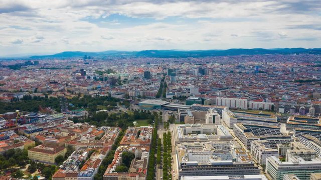 flight over vienna cityscape sunny day train station aerial panorama 4k timelapse austria 