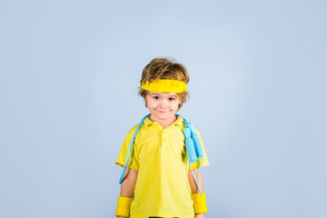 Active kid with jumping rope. Cute boy exercising with jumping rope. Boy with jump rope. Fitness, healthy lifestyle. Sport, exercise, training. Sporty boy with skipping rope. Little kid doing sports.
