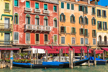 Fototapeta na wymiar Venice Grand Canal with colorful facades of old medieval houses , Italy. Venice is a popular tourist destination of Europe.