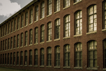 old brick building with lots of windows 