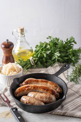 grilled italian german sausage on cast iron pan