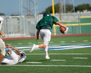 Great action photos of high school football players making amazing plays during a football game