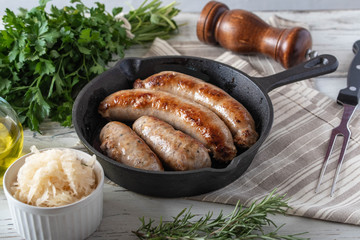 grilled italian german sausage on cast iron pan
