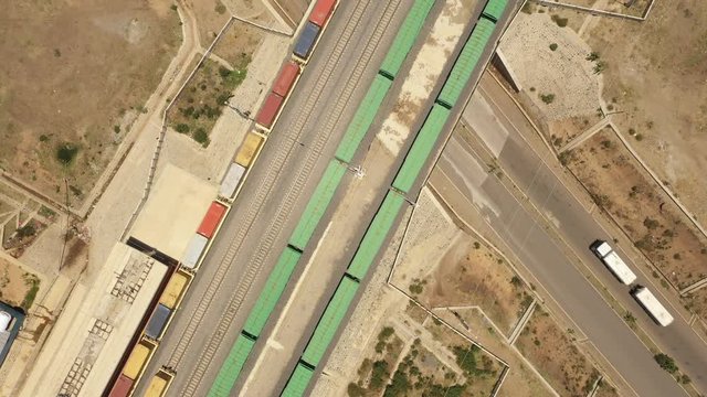 China Africa relations - Overhead drone shot flying over cargo trains on railway line built and partly financed by Chinese government